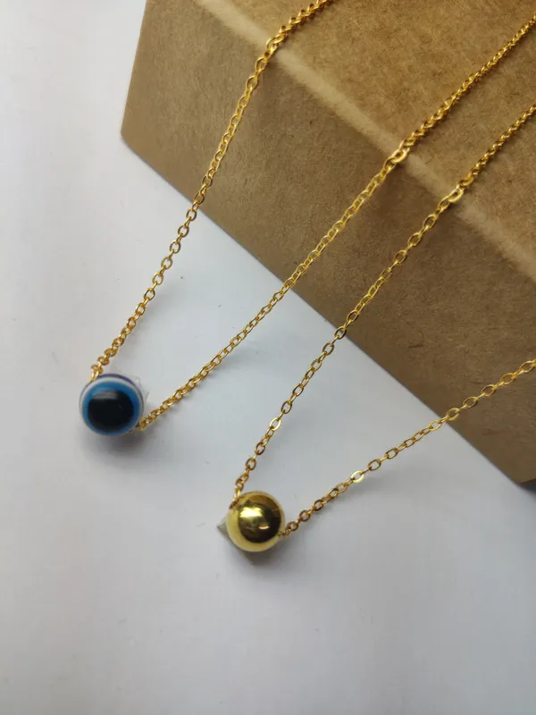 Gold_Brass_Premium_Evil_Eye_&_Plain_Gold_Ball_Pendant_Combo_For_Women_(Pack_Of_2)