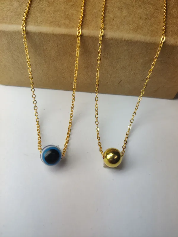Gold_Brass_Premium_Evil_Eye_&_Plain_Gold_Ball_Pendant_Combo_For_Women_(Pack_Of_2)