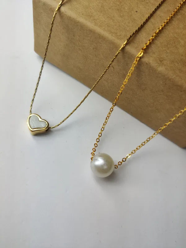 Gold_Brass_Premium_Pearl_Heart_&_Round_Ball_Pendant_Combo_For_Women_(Pack_Of_2)