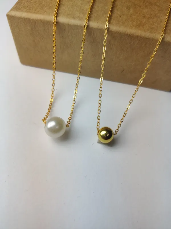 Gold_And_White_Brass_Premium_Pearl_&_Plain_Ball_Pendant_Combo_For_Women_(Pack_Of_2)
