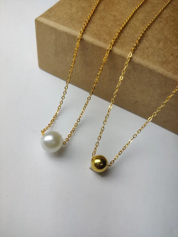 Gold_And_White_Brass_Premium_Pearl_&_Plain_Ball_Pendant_Combo_For_Women_(Pack_Of_2)