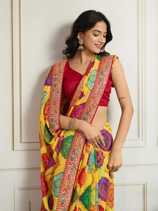 Sunshine_Yellow_Party_Wear_Soft_Georgette_Bandhej_Saree_with_Multi_Embroidery_Lace_Border