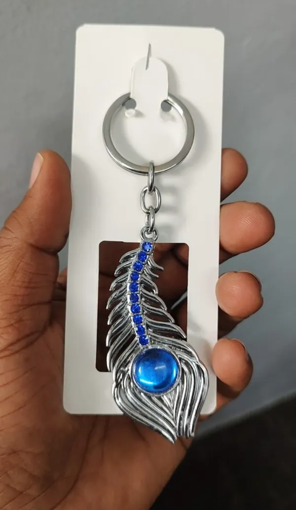 Omg_Movie_Peacock_Keychain,_Silver-Toned_Metal_With_Blue_Crystal_Accents