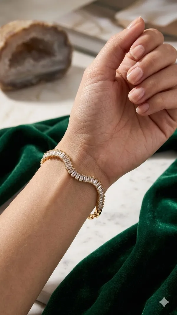 Shubh_aura_presents_A_glamorous_gold_plated_bracelet_with_transparant_Baguette_cut_stones,_crafted_in_a_refined_tennis_style,_Its_Sparkle_and_polished_finish_add_timelss_beauty