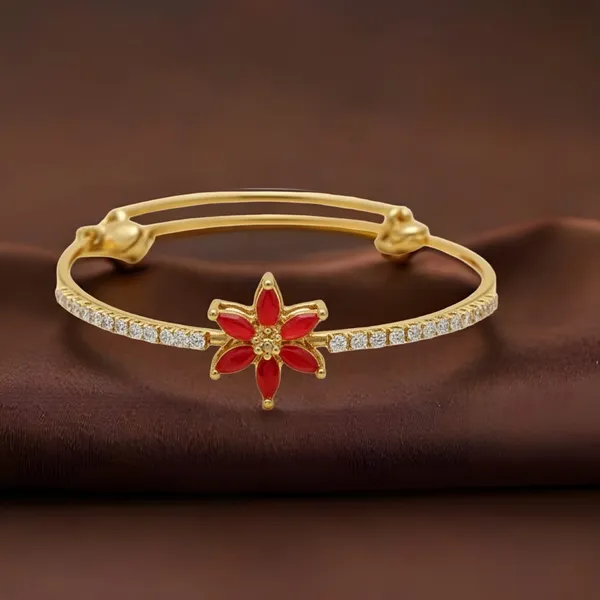 Gold_Toned_Bracelet_With_Central_Star_Shaped_Motiff_Of_Red_Gemstones_In_Floral_Setting