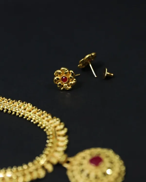 Gold_Matinee_Length_Chain_With_Floral_Pendant_Set_For_Women