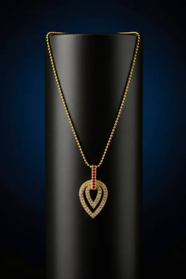 Elegant_Double_Heart_Gold_Pendant_Necklace_With_Red_Gemstones.