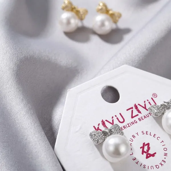 Pearl_Drop_Earrings_With_Textured_Gold_Bow