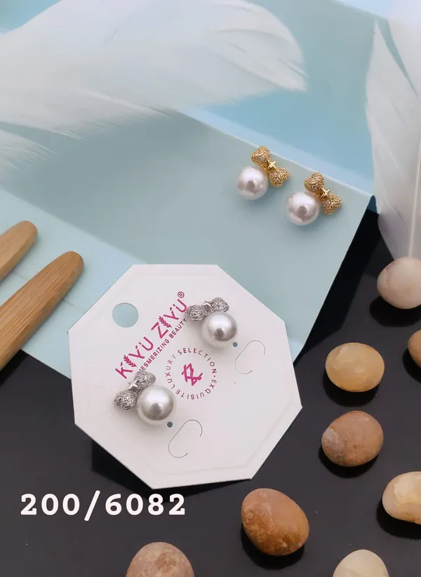Pearl_Drop_Earrings_With_Textured_Gold_Bow