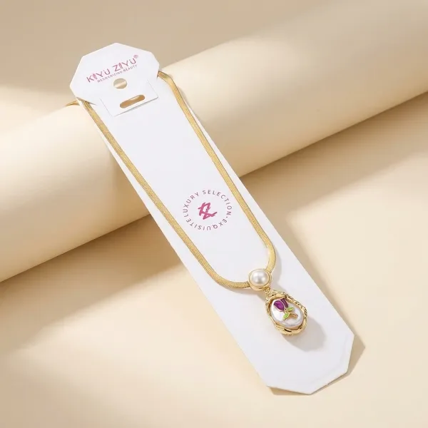 Gold_Chain_Necklace_With_Pearl_And_Pink_Gemstone_Pendant