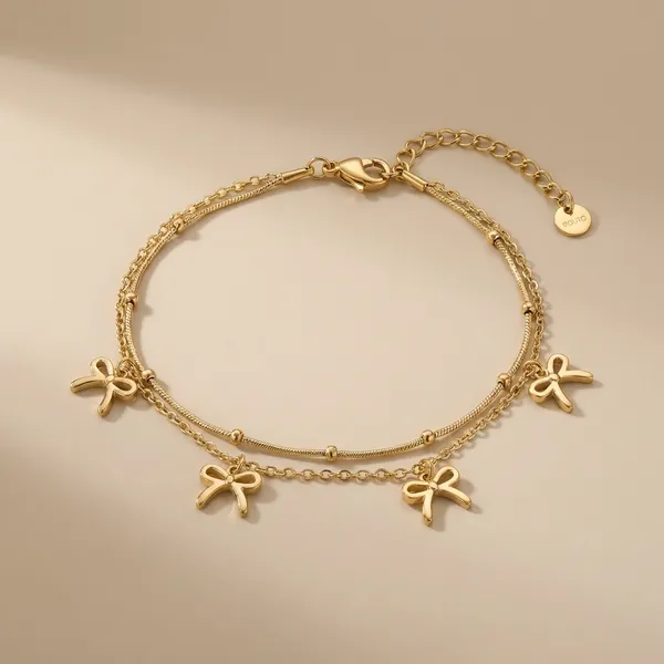 Exclusive_Collection_Gold-Toned_Bow_Charm_Anklet_And_Bracelet_Set