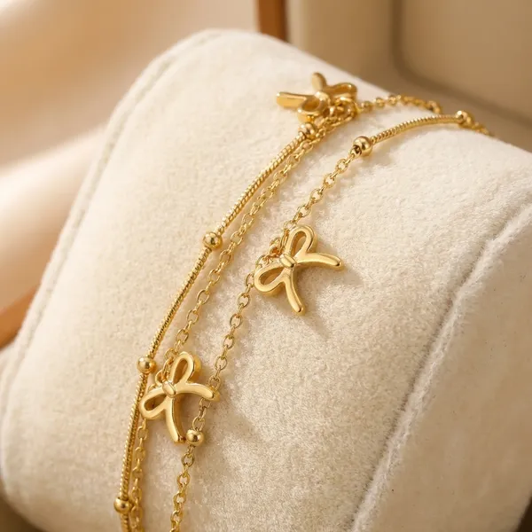 Exclusive_Collection_Gold-Toned_Bow_Charm_Anklet_And_Bracelet_Set