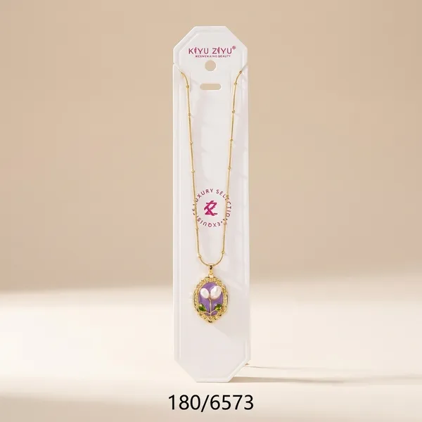 Delicate_Gold-Toned_Floral_Pendant_Necklace_With_Gemstone_Accents