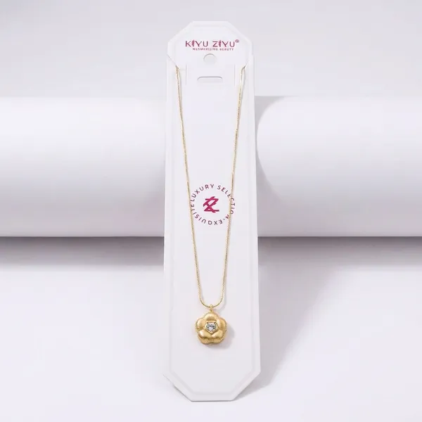Gold-Toned_Flower_Pendant_Necklace_With_Crystal_Center