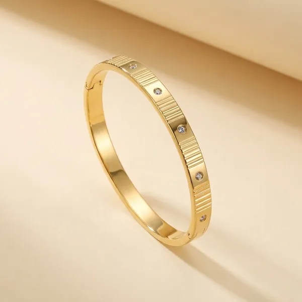 Elegant_Gold-Tone_Bangle_Bracelet_Set_With_Crystal_Embellishments_-_Kavu_Zivu_Exclusive_Collection