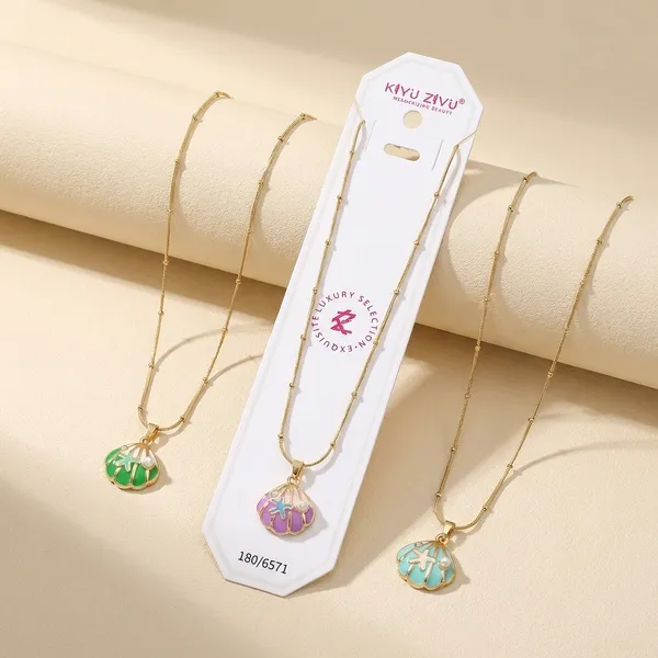Tropical_Leaf_Pendant_Necklace_Set_-_Set_Of_3_Gold-Tone_Chain_Necklaces_With_Colorful_Enamel_Monstera_Leaf_Charms