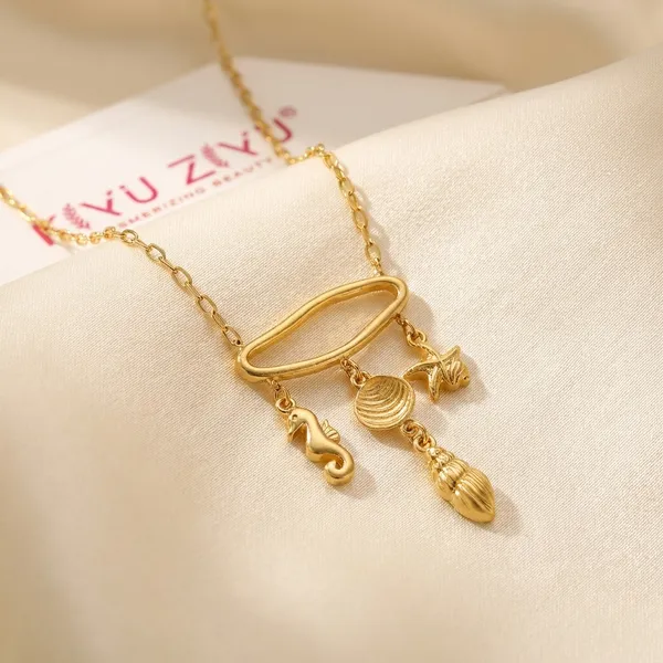 Gold-Toned_Charm_Pendant_Necklace_With_Hanging_Accents
