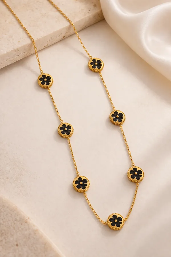 Elegant_Golden_Clover_Necklace_with_Black_&_White_Stone_Accents