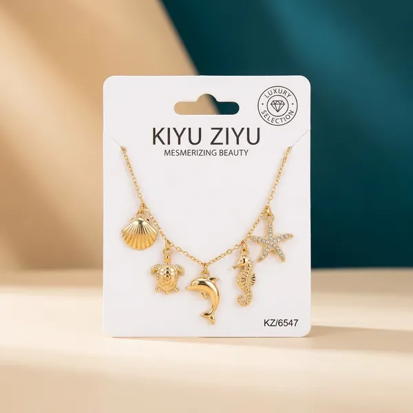 Gold-Tone_Seashell_Charm_Necklace_With_Star_And_Marine_Life_Pendants