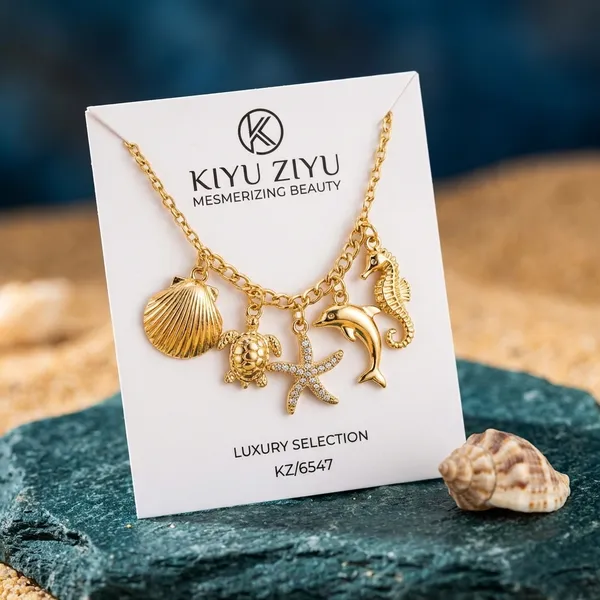 Gold-Tone_Seashell_Charm_Necklace_With_Star_And_Marine_Life_Pendants