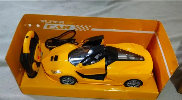 _Rechargeable_Super_Car_with_SMOKE_Function,_Openable_Doors_&_Lights_(yellow)
