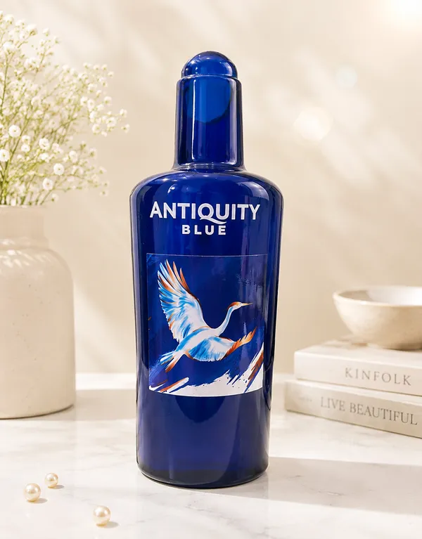 Upcycled_Glass_Jug_with_Signature_Name_&_Logo_Sticker_–_700_ML_|_8.5_Inch_|_Made_from_Antiquity_Blue®_Bottles