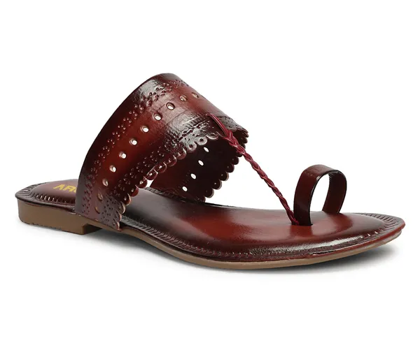 A_pair_of_stylish_women�s_slip-on_loafers_in_a_warm_tan/brown_color_with_a_subtle_ribbed_texture.