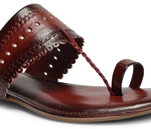 A_pair_of_stylish_women�s_slip-on_loafers_in_a_warm_tan/brown_color_with_a_subtle_ribbed_texture.