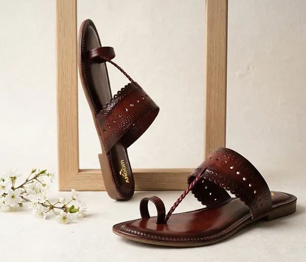 A_pair_of_stylish_women�s_slip-on_loafers_in_a_warm_tan/brown_color_with_a_subtle_ribbed_texture.