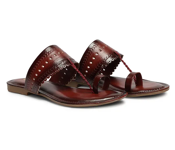A_pair_of_stylish_women�s_slip-on_loafers_in_a_warm_tan/brown_color_with_a_subtle_ribbed_texture.