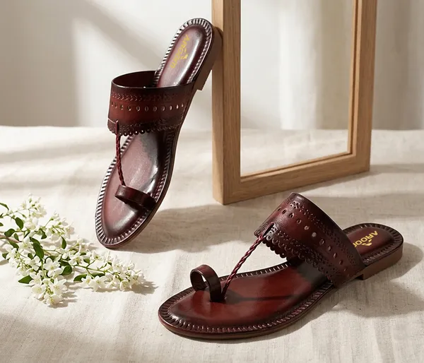 A_pair_of_stylish_women�s_slip-on_loafers_in_a_warm_tan/brown_color_with_a_subtle_ribbed_texture.