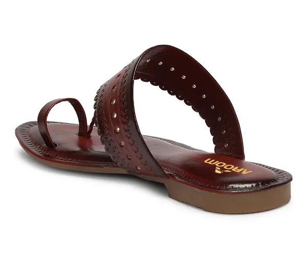 A_pair_of_stylish_women�s_slip-on_loafers_in_a_warm_tan/brown_color_with_a_subtle_ribbed_texture.