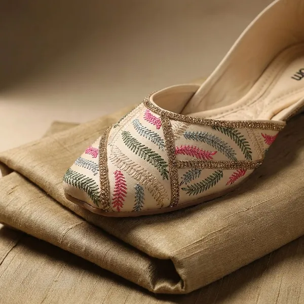 Cream_Elegant_Embroidered_Ethnic_Jutti_For_Women_With_Bead_Detailing_And_Comfortable_Flat_Sole