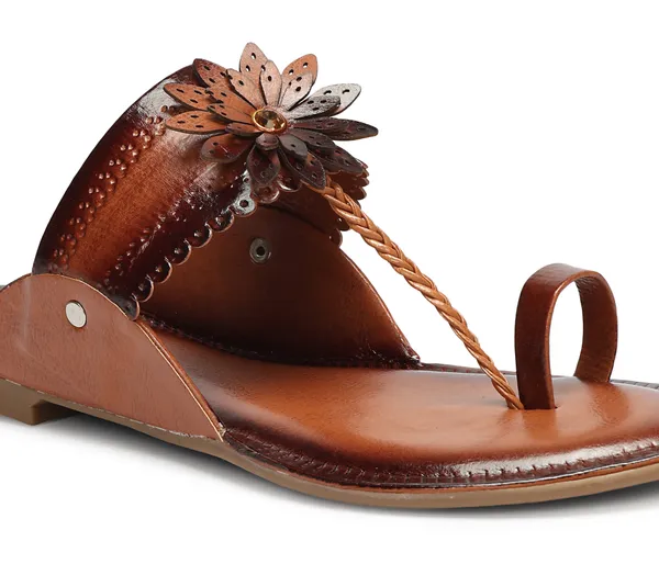 A_pair_of_stylish_women�s_slip-on_loafers_in_a_warm_tan/brown_color_with_a_subtle_ribbed_texture.