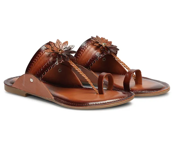A_pair_of_stylish_women�s_slip-on_loafers_in_a_warm_tan/brown_color_with_a_subtle_ribbed_texture.