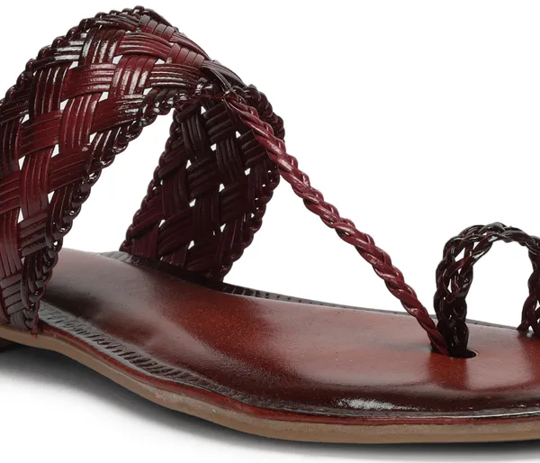 A_pair_of_stylish_women�s_slip-on_loafers_in_a_warm_tan/brown_color_with_a_subtle_ribbed_texture.
