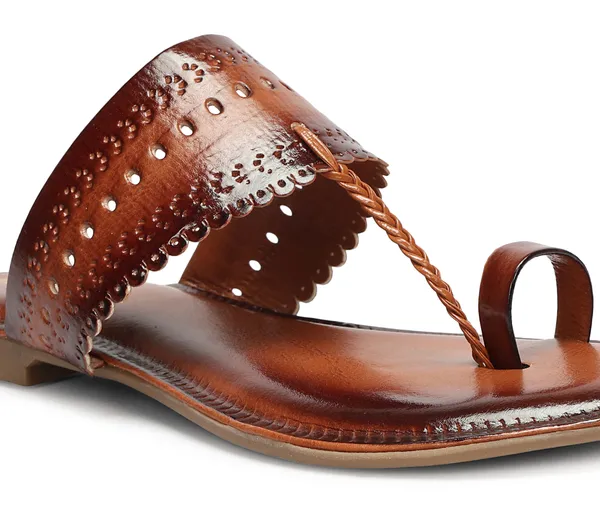 A_pair_of_stylish_women�s_slip-on_loafers_in_a_warm_tan/brown_color_with_a_subtle_ribbed_texture.