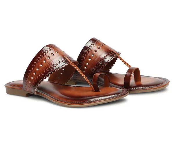 A_pair_of_stylish_women�s_slip-on_loafers_in_a_warm_tan/brown_color_with_a_subtle_ribbed_texture.