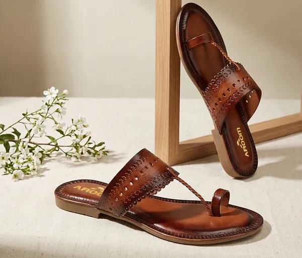 A_pair_of_stylish_women�s_slip-on_loafers_in_a_warm_tan/brown_color_with_a_subtle_ribbed_texture.