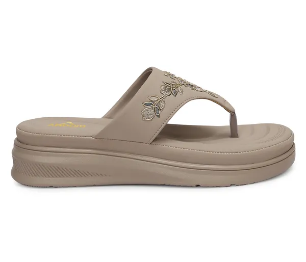 A_pair_of_stylish_women�s_slip-on_loafers_in_a_warm_tan/brown_color_with_a_subtle_ribbed_texture.