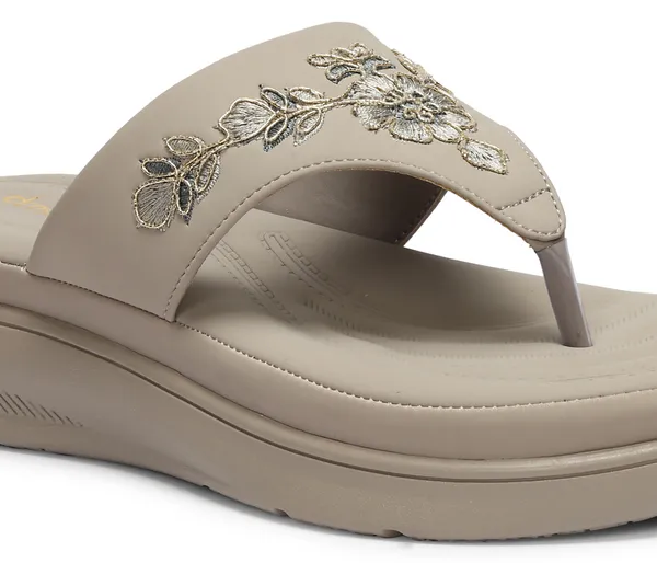 A_pair_of_stylish_women�s_slip-on_loafers_in_a_warm_tan/brown_color_with_a_subtle_ribbed_texture.
