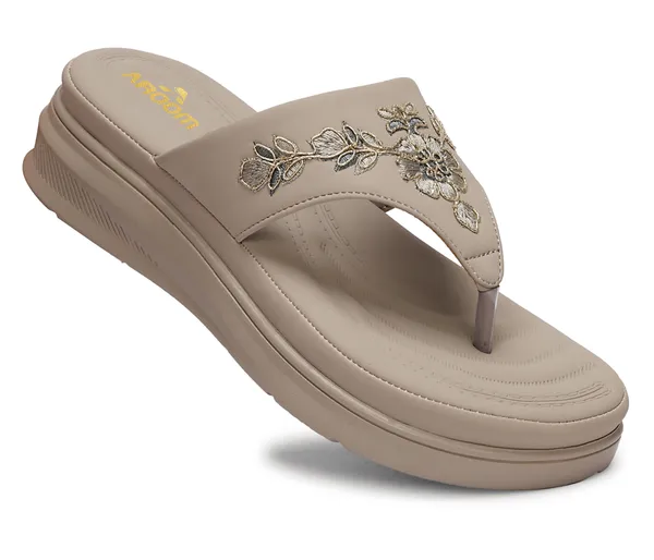 A_pair_of_stylish_women�s_slip-on_loafers_in_a_warm_tan/brown_color_with_a_subtle_ribbed_texture.