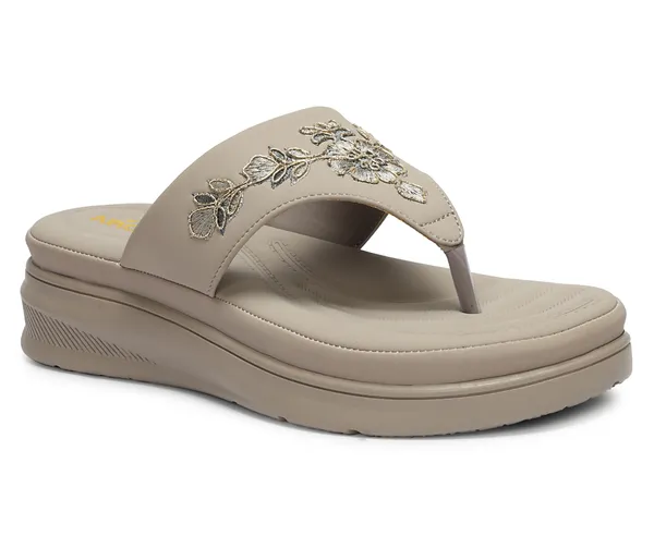 A_pair_of_stylish_women�s_slip-on_loafers_in_a_warm_tan/brown_color_with_a_subtle_ribbed_texture.