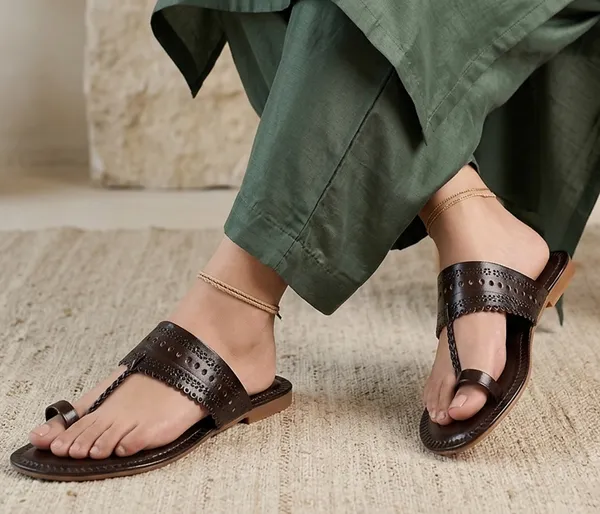 A_pair_of_stylish_women�s_slip-on_loafers_in_a_warm_tan/brown_color_with_a_subtle_ribbed_texture.