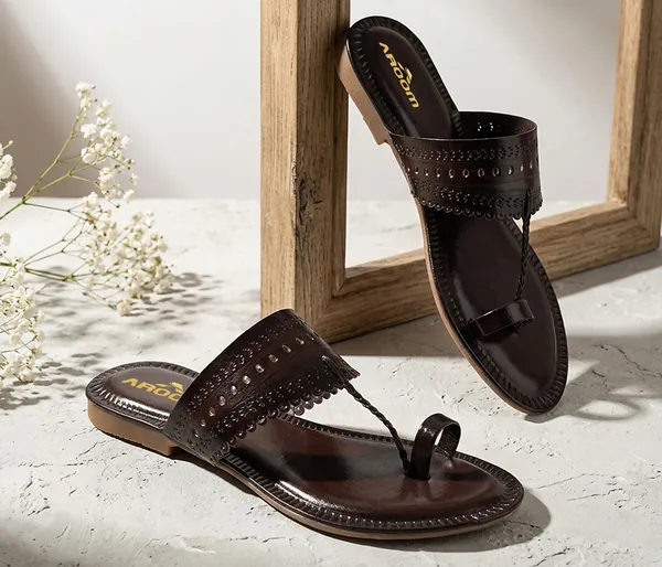 A_pair_of_stylish_women�s_slip-on_loafers_in_a_warm_tan/brown_color_with_a_subtle_ribbed_texture.