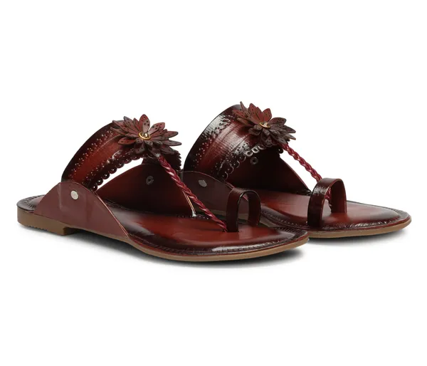 A_pair_of_stylish_women�s_slip-on_loafers_in_a_warm_tan/brown_color_with_a_subtle_ribbed_texture.