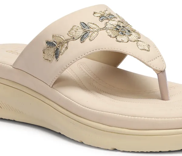 A_pair_of_stylish_women�s_slip-on_loafers_in_a_warm_tan/brown_color_with_a_subtle_ribbed_texture.