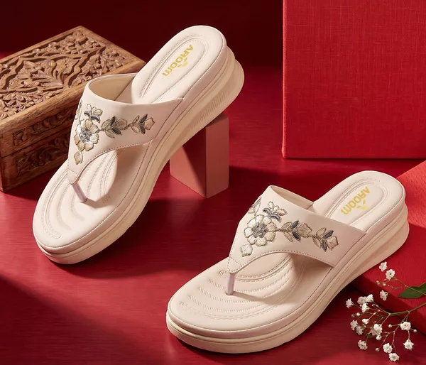 A_pair_of_stylish_women�s_slip-on_loafers_in_a_warm_tan/brown_color_with_a_subtle_ribbed_texture.