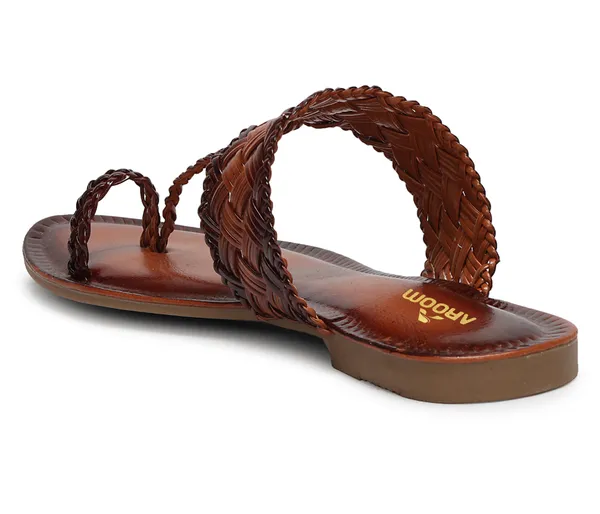 A_pair_of_stylish_women�s_slip-on_loafers_in_a_warm_tan/brown_color_with_a_subtle_ribbed_texture.