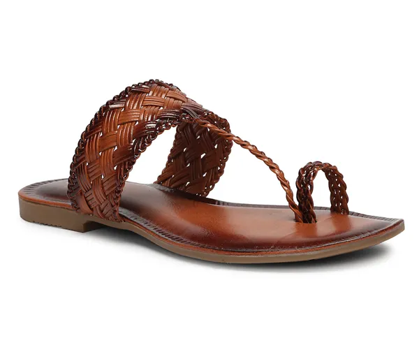 A_pair_of_stylish_women�s_slip-on_loafers_in_a_warm_tan/brown_color_with_a_subtle_ribbed_texture.